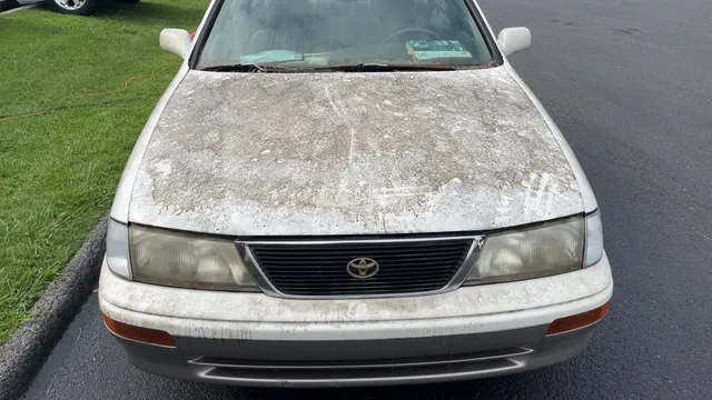 White Toyota Avalon, front view before exterior washing and waxing