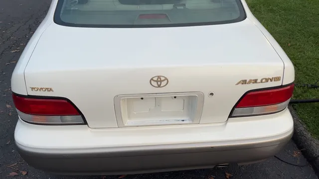 White Toyota Avalon, rear view after exterior washing and waxing